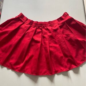 Red pleated mini skirt